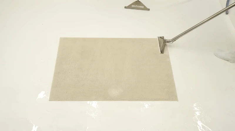 Rug returned to its light cream color after extraction with a cleaning wand